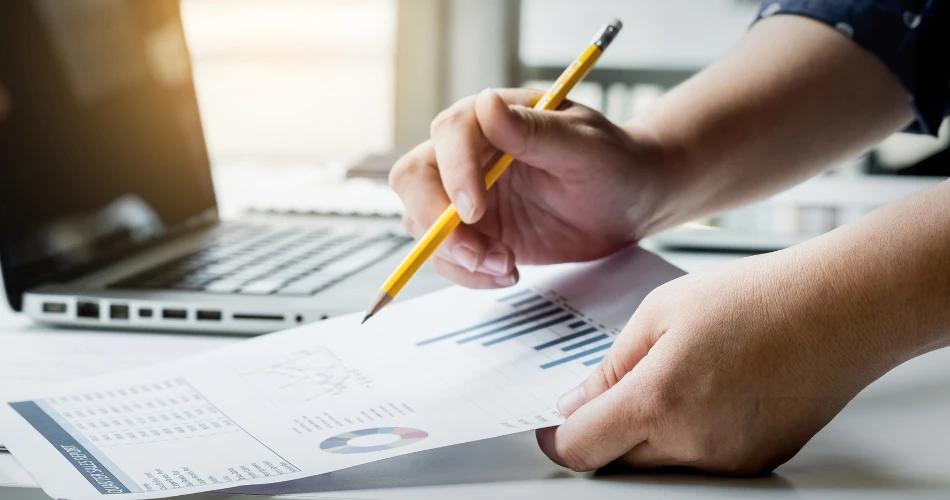 JEE Advanced 2025 paper analysis with student reviewing exam data and charts.