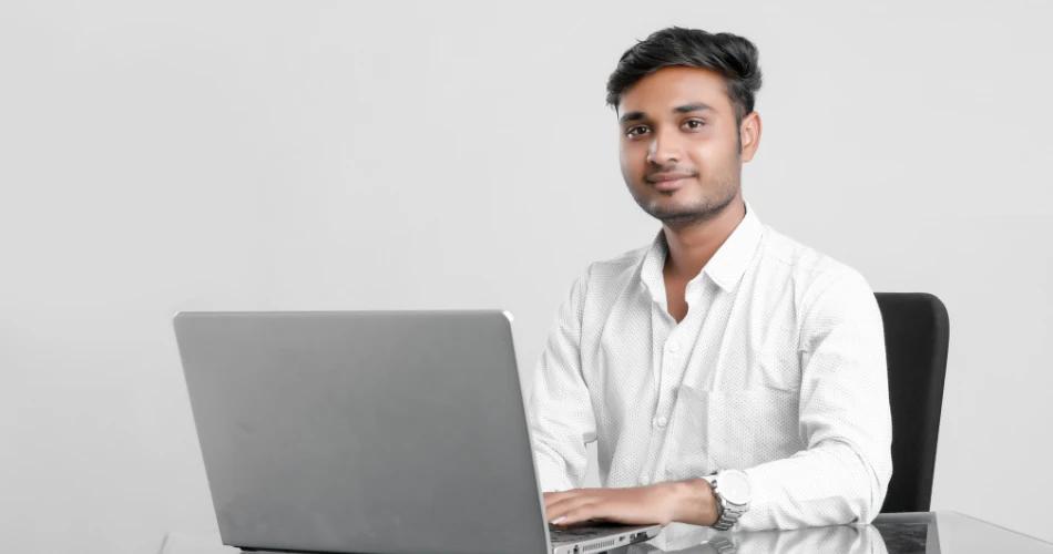 Student downloading JEE Advanced AAT 2025 scorecard on laptop for B.Arch admission
