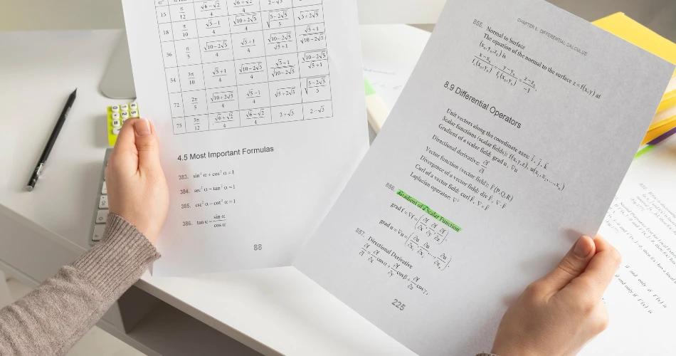 Student holding HSC answer sheets with formulas, representing the verification and revaluation process for HSC 2025 exam results.