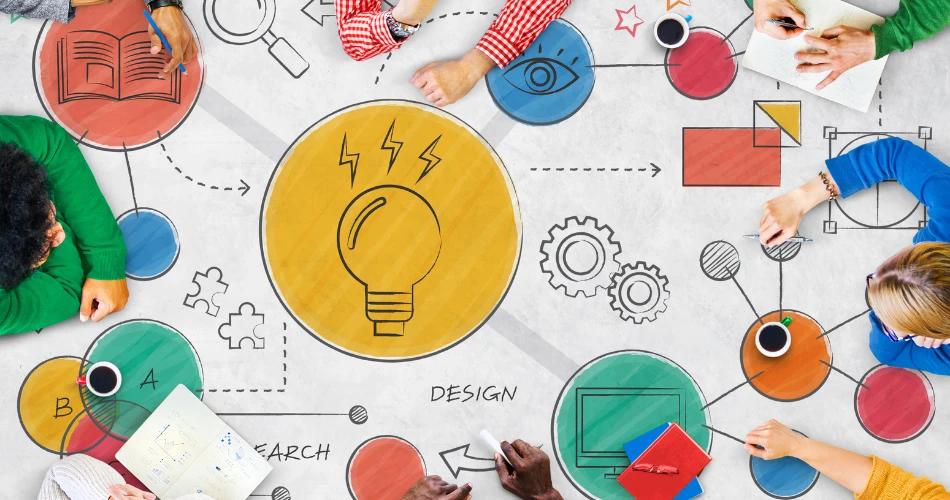 A diverse group of individuals collaborating around a table, brainstorming and designing ideas for Eureka! Junioer Business Model Competition 2025