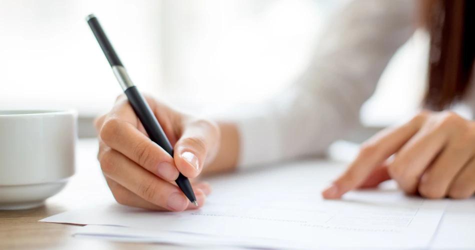 Banner displaying SSC Maharashtra supplementary exam dates with a student writing on an exam form.